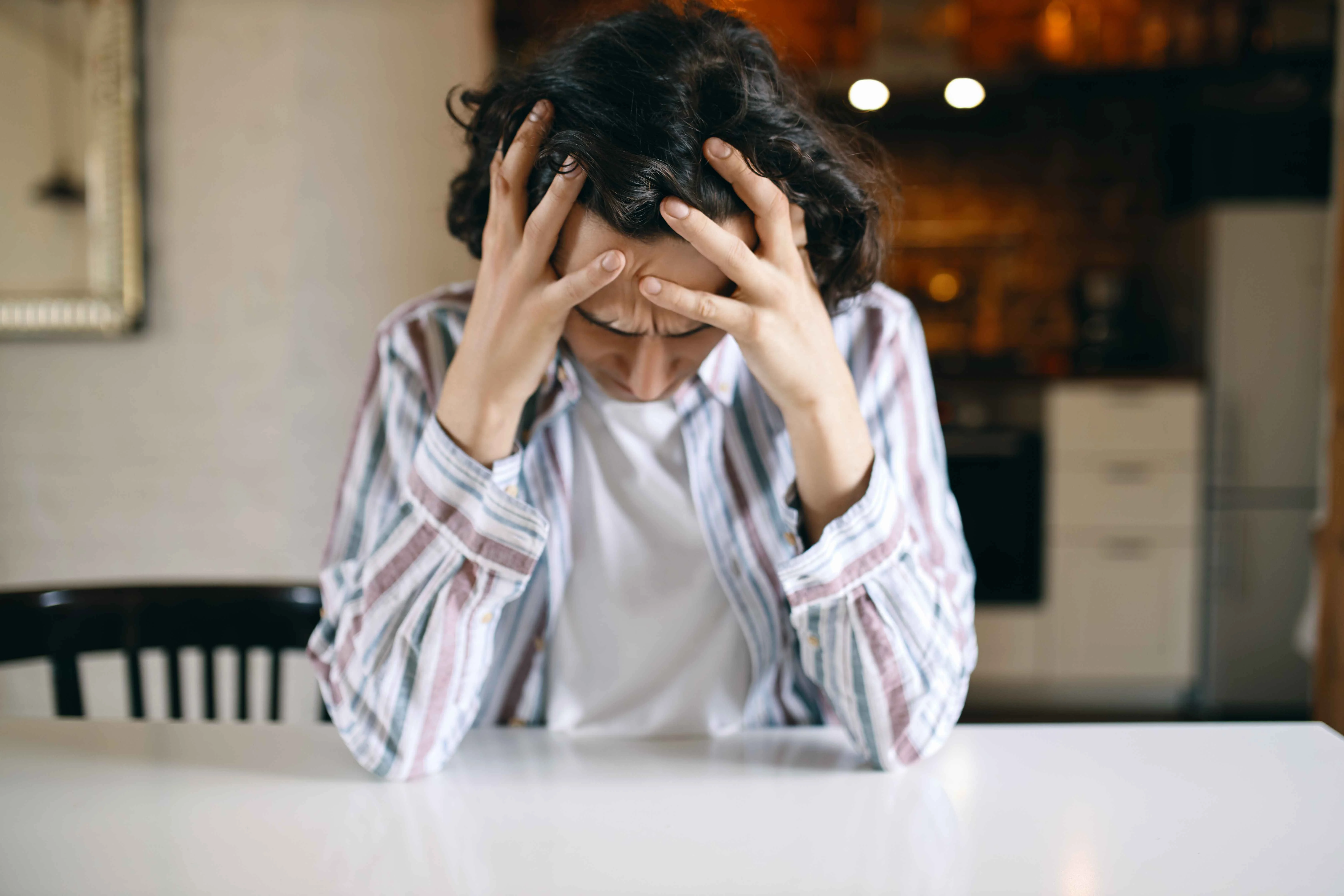 Frustrated Unhappy Young Man Having Depressed Look Looking Down Holding Hands His Head Stressed With Financial Problems Because He Got Fired 11zon