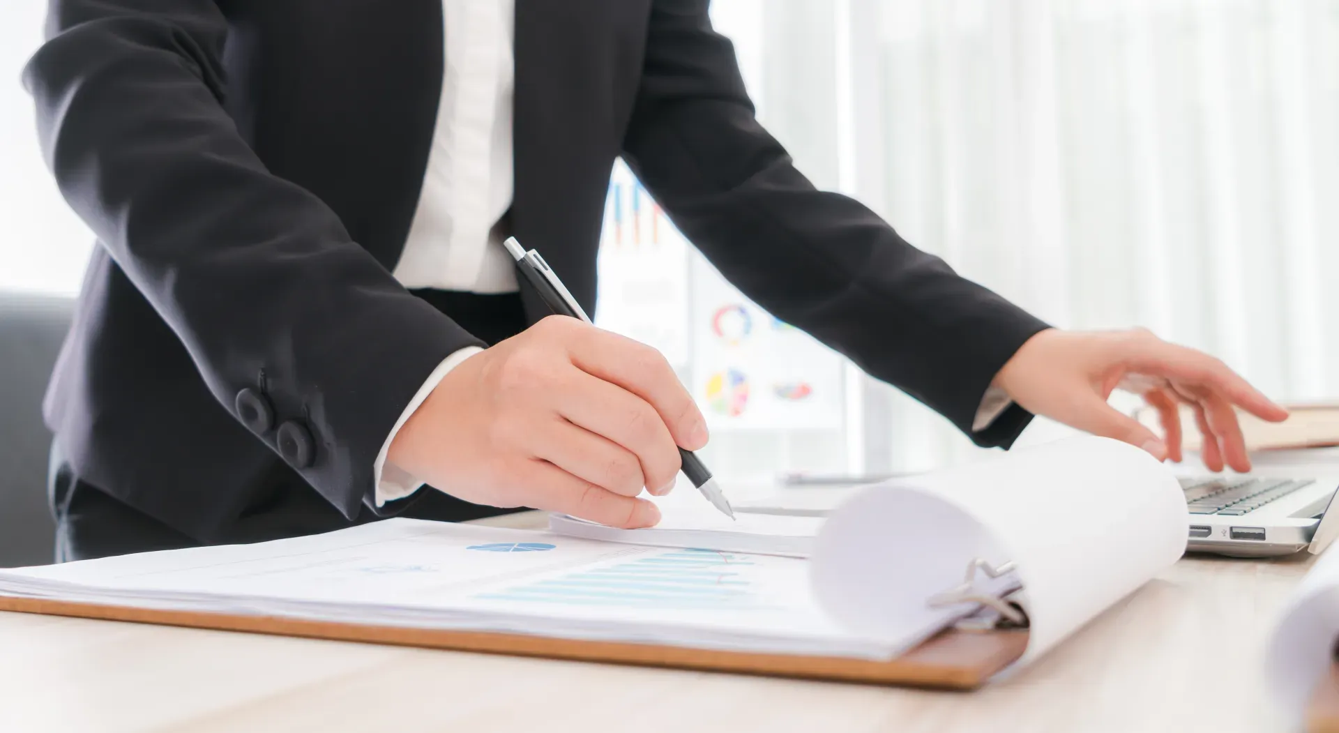 Business People Using Pencil Noting Laptop